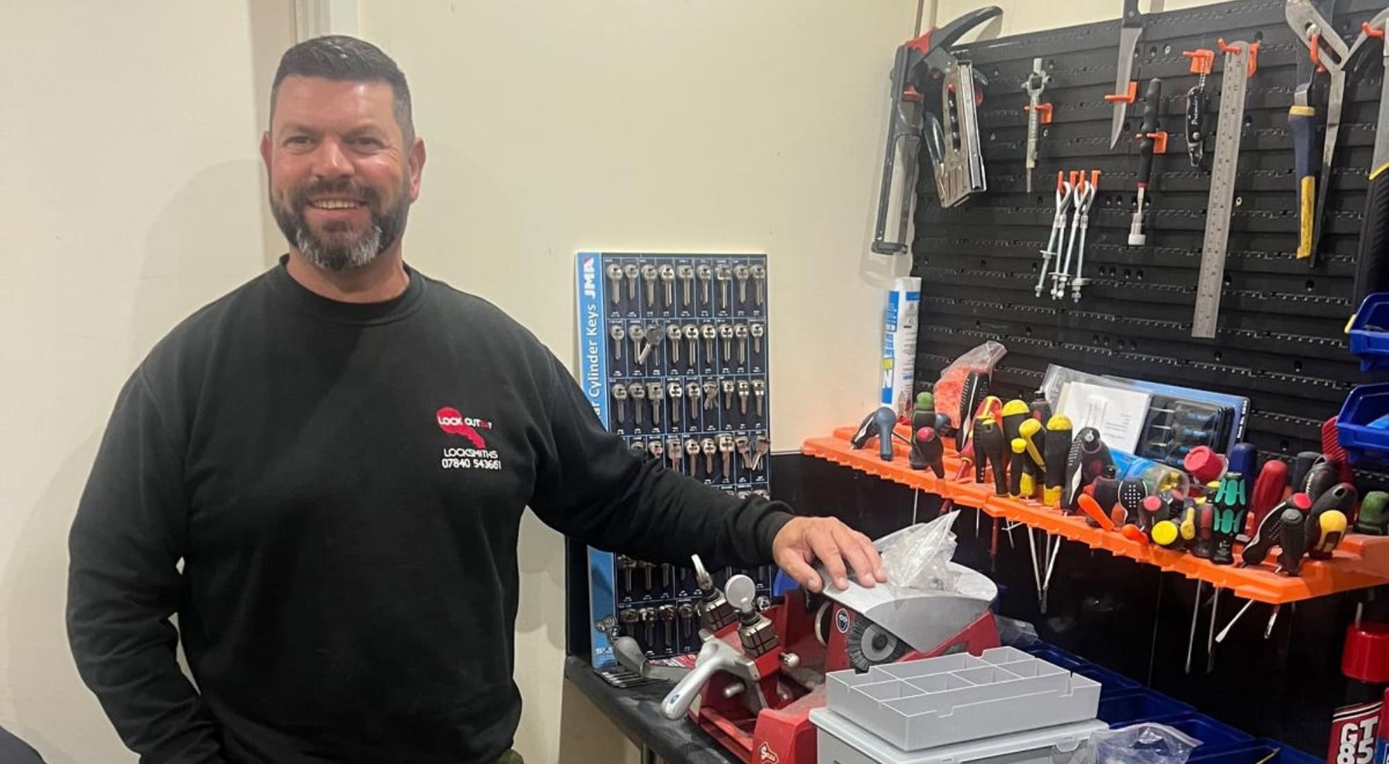 one of our colchester locksmiths showing off their tools