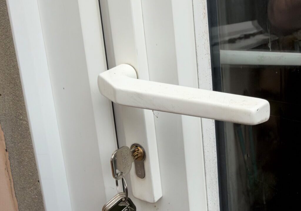 Close-up image showing front white uPVC door with keys inserted into Euro profile lock cylinder on Shrubland Road property in Colchester.